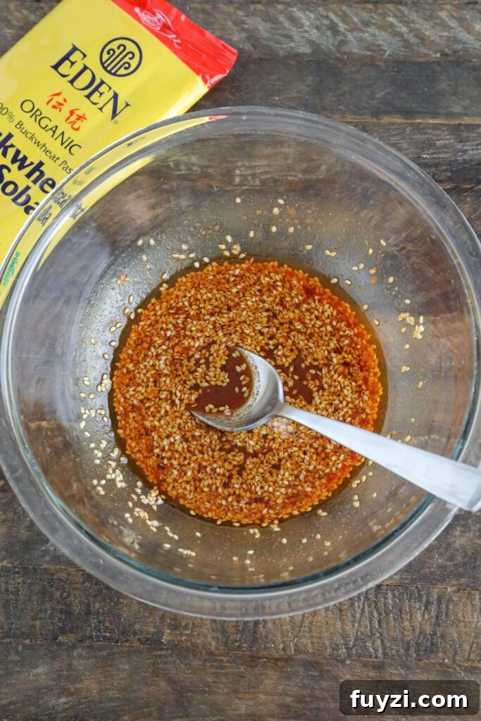 Korean Noodle Bowl sauce mixed in bowl with spoon