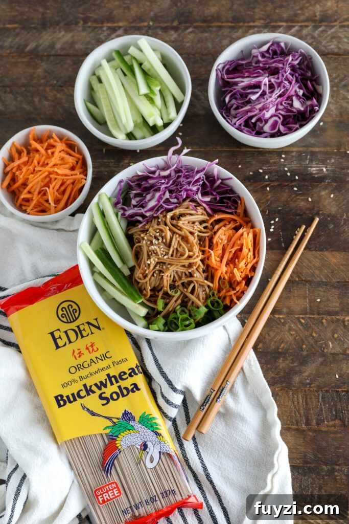 Vegan Bibim Guksu (Korean Spicy Cold Noodles) served in bowl with chopsticks