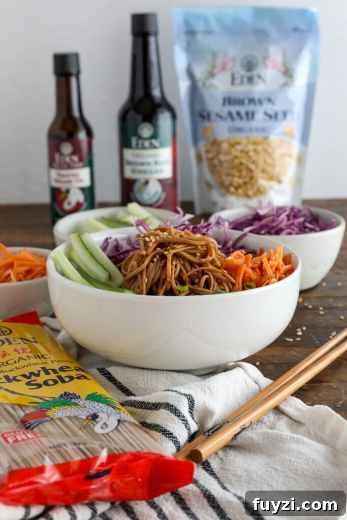 Vegan Bibim Guksu (Korean Spicy Cold Noodles) served in bowl with chopsticks