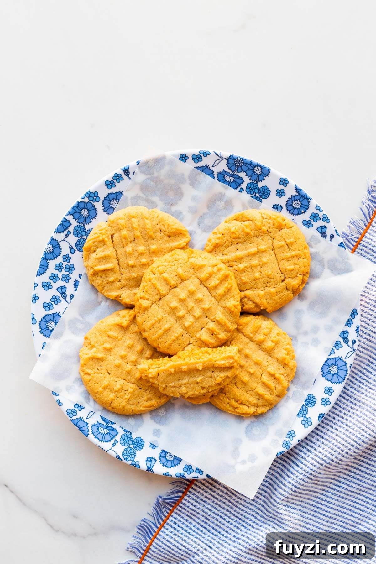 Classic Peanut Butter Cookie Recipe with Natural Peanut Butter 12 A plate of peanut butter cookies ready to be eaten.