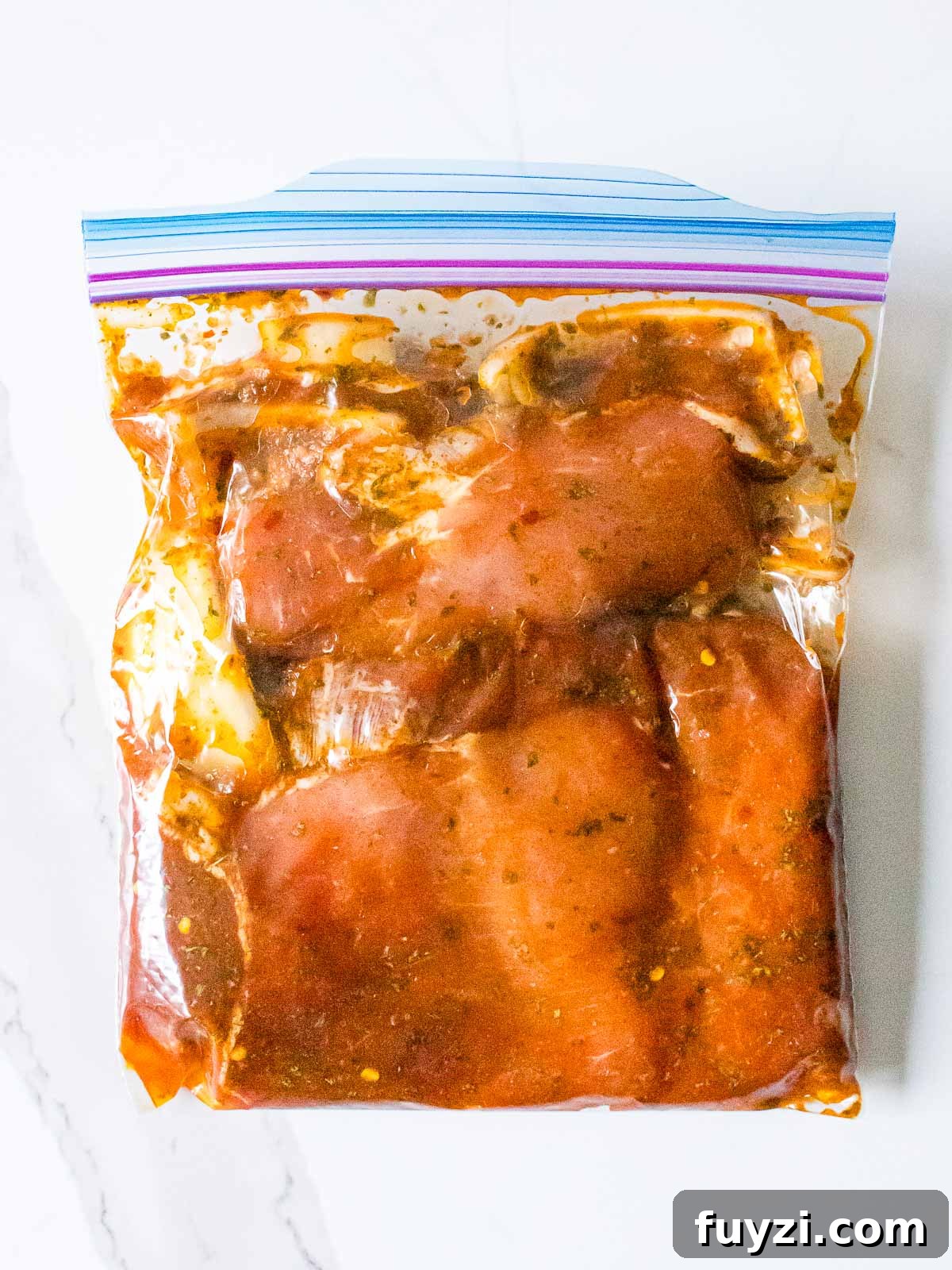 pork chops marinating in a ziplock bag