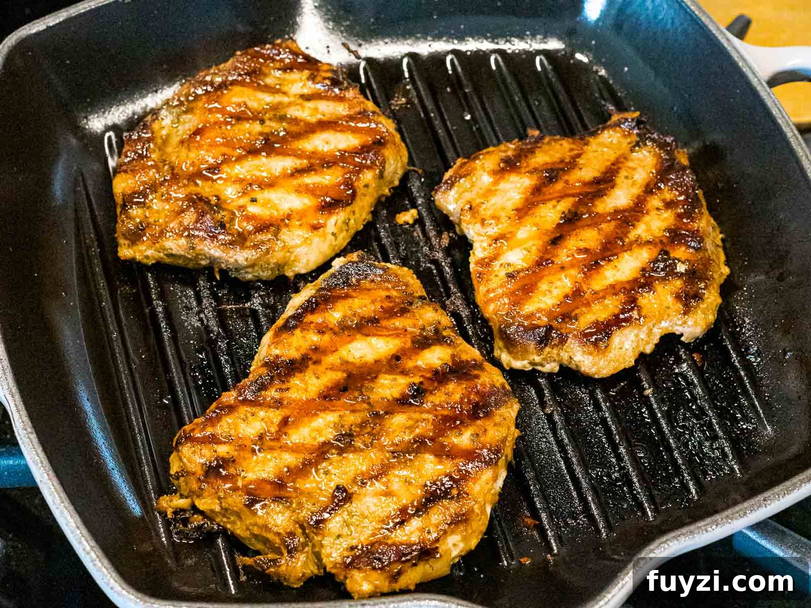 easy grilled pork chops with grill marks in a pan