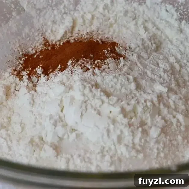 adding dry ingredients for blueberry pie filling
