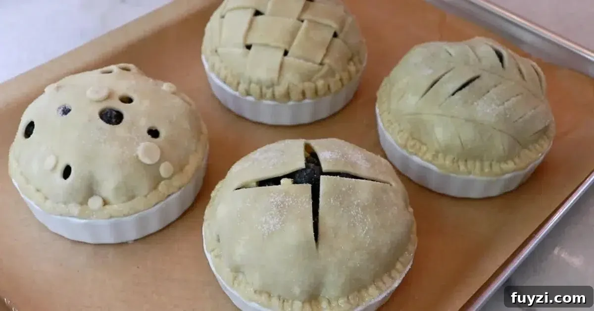 4 blueberry pies assembled on a tray