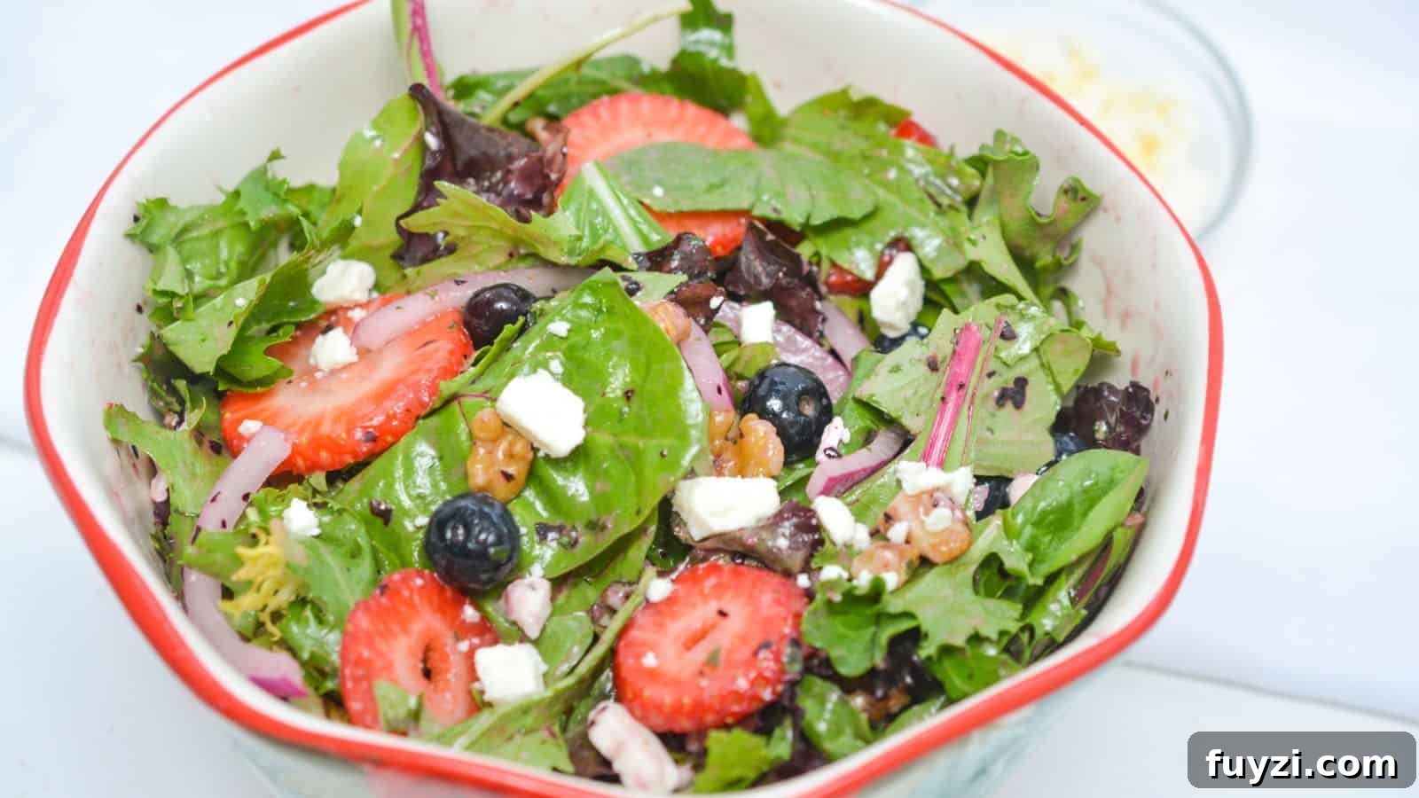 27 Crowd-Pleasing Outdoor Potluck Recipes for Late Summer 23 A salad with strawberries, blueberries and feta cheese.