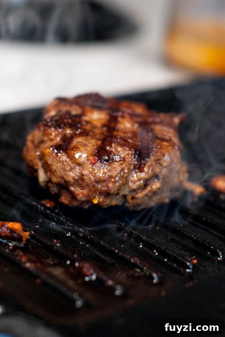Grilling a Pepper Jack Stuffed Doritos Burger.