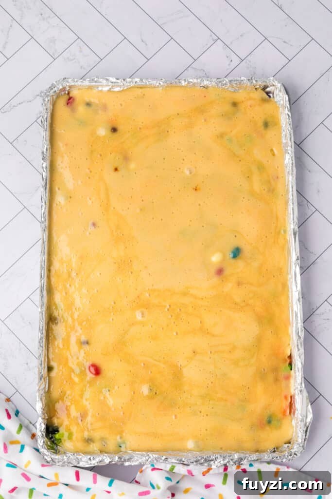 the candy mixture poured over the jelly bean to harden