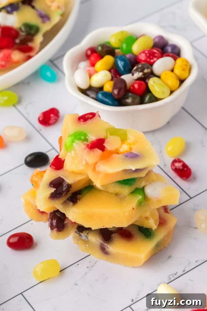 pieces of jelly bean brittle stacked on top of each other