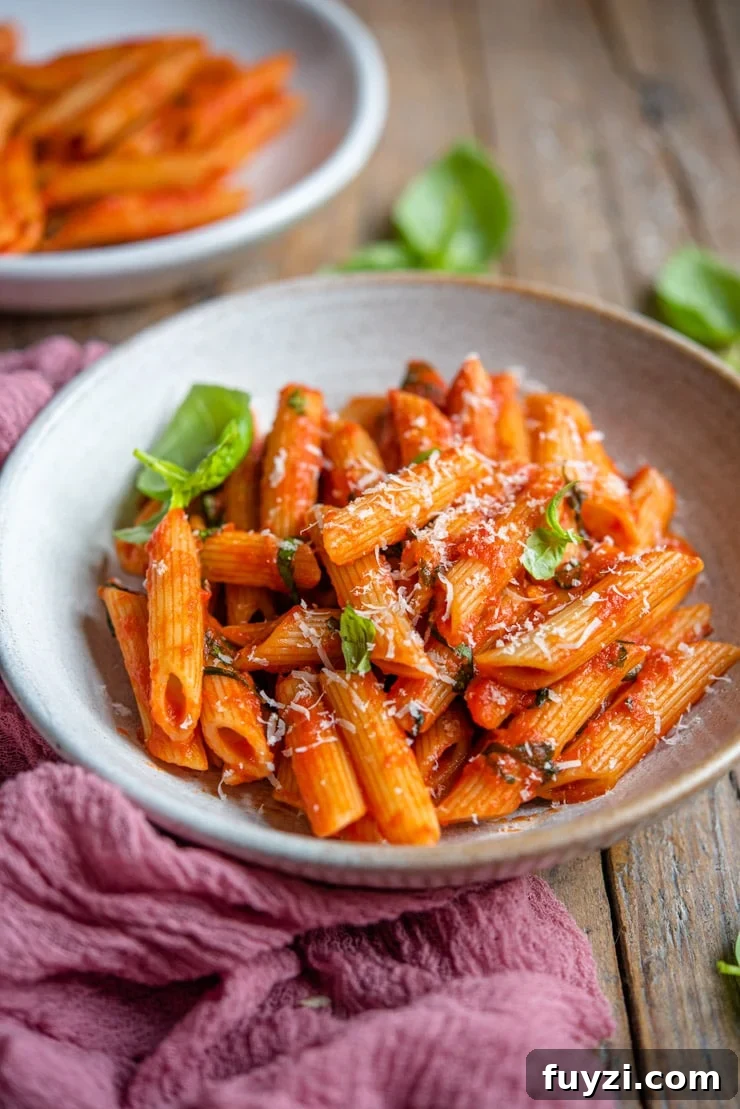 Penne Pomodoro: Classic Tomato Basil Pasta Recipe 4 A side shot of penne pomodoro in a rustic bowl