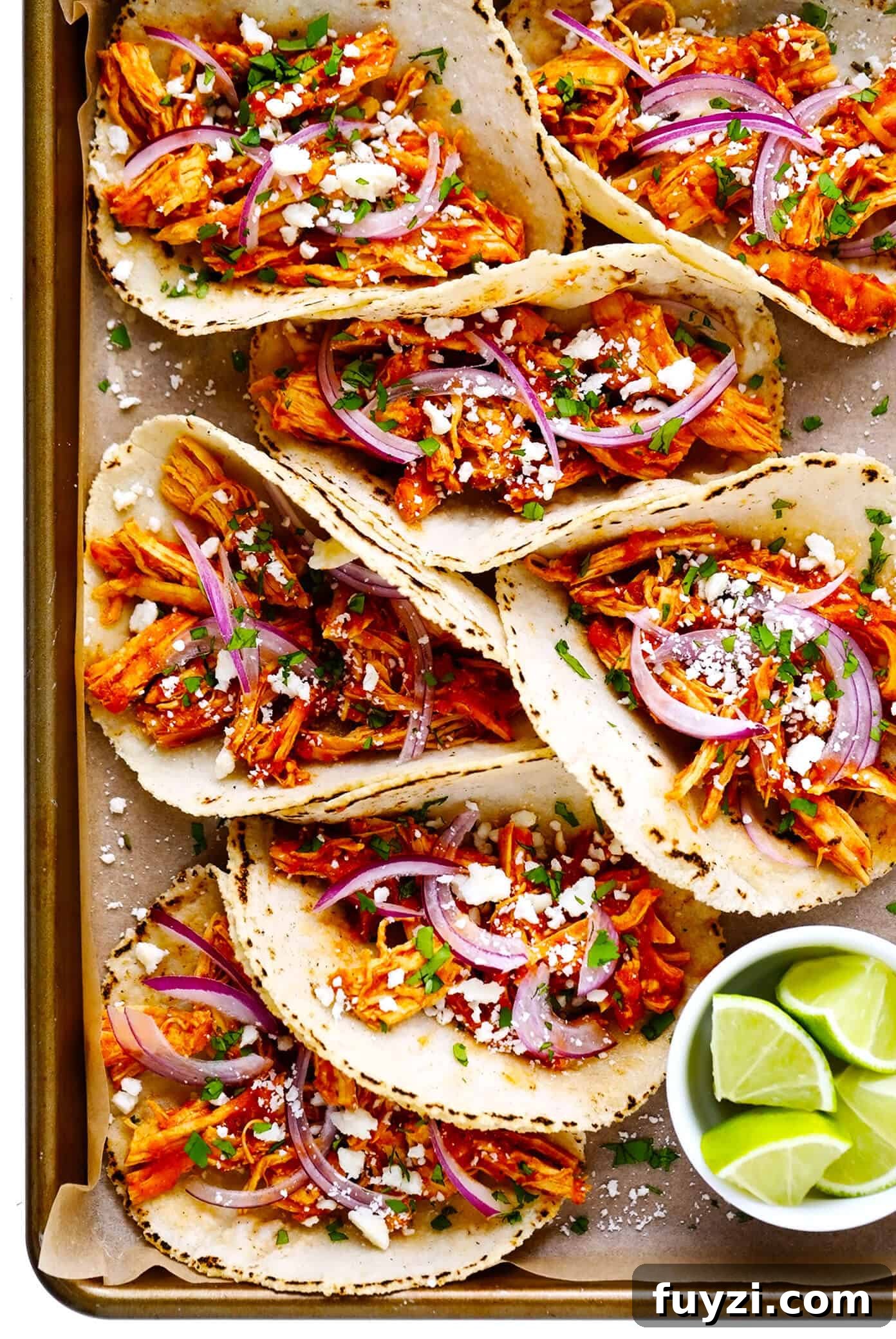 Chicken Tinga Tacos - smoky chipotle chicken on warm corn tortillas with fresh toppings Chicken Tinga Tacos Recipe