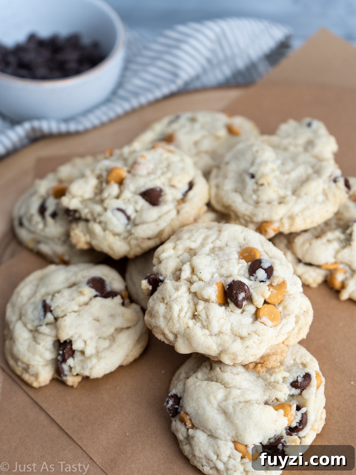 Butterscotch chocolate chip cookies on brown parchment paper.