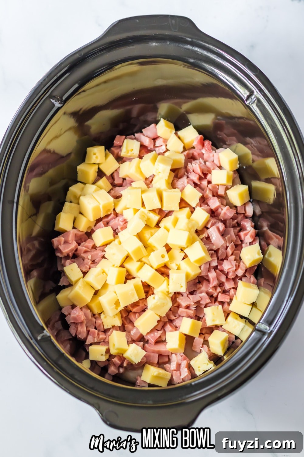 Slow Cooker Chicken Cordon Bleu Recipe with Ham and Swiss 5 chicken breasts, diced ham and diced cheese in a slow cooker