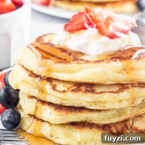These lemon pancakes have a deliciously bright & sunny flavor thanks to fresh lemon juice and lemon zest. They're extra fluffy with golden edges, and taste delicious with summer berries or syru