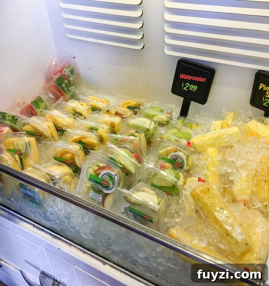packaged fresh fruit for sale at a Disneyland fruit cart, a safe gluten-free snack option