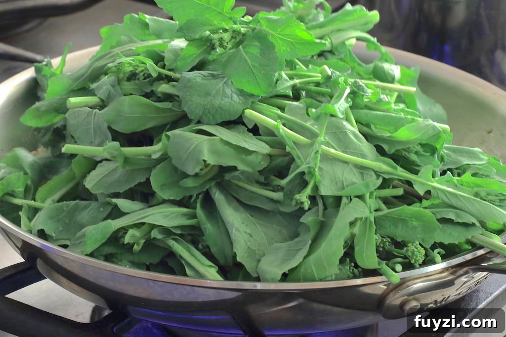 Broccoli rabe added to the skillet