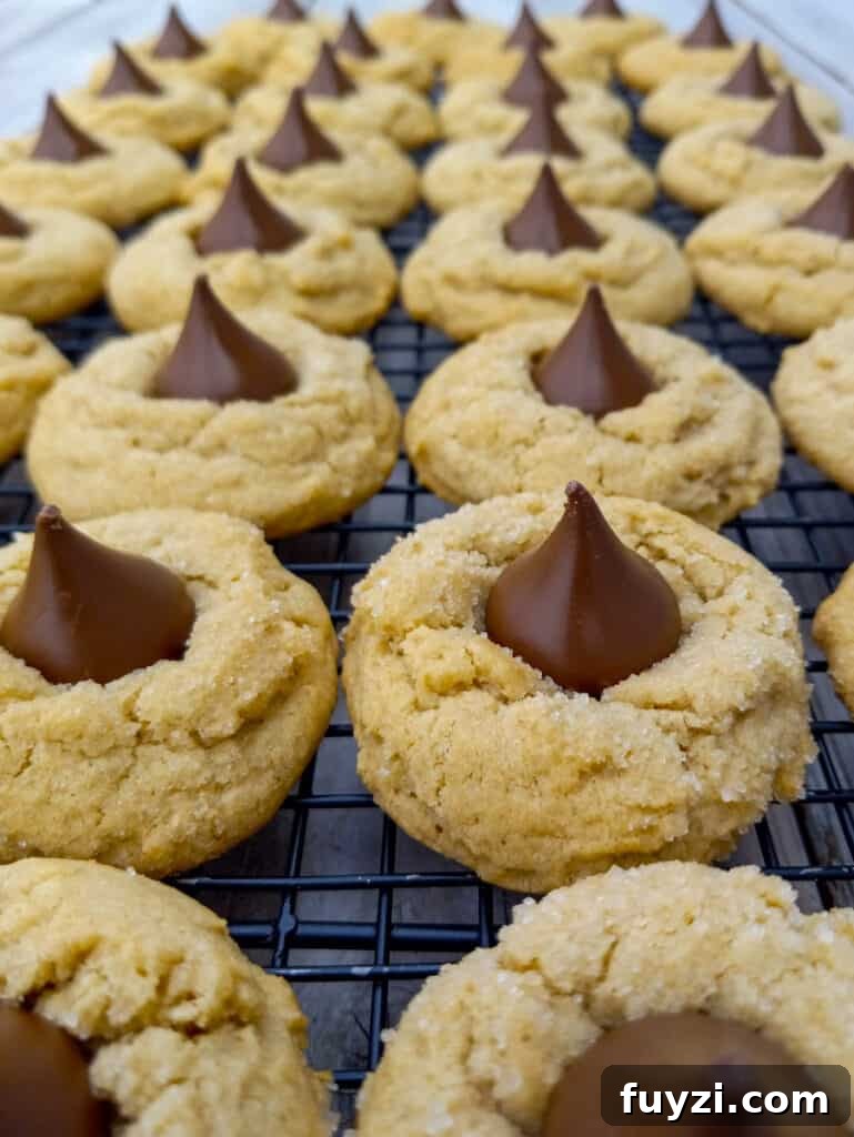 Classic Amish Peanut Butter Blossoms Recipe 6 wire rack full of Amish peanut butter kiss cookies