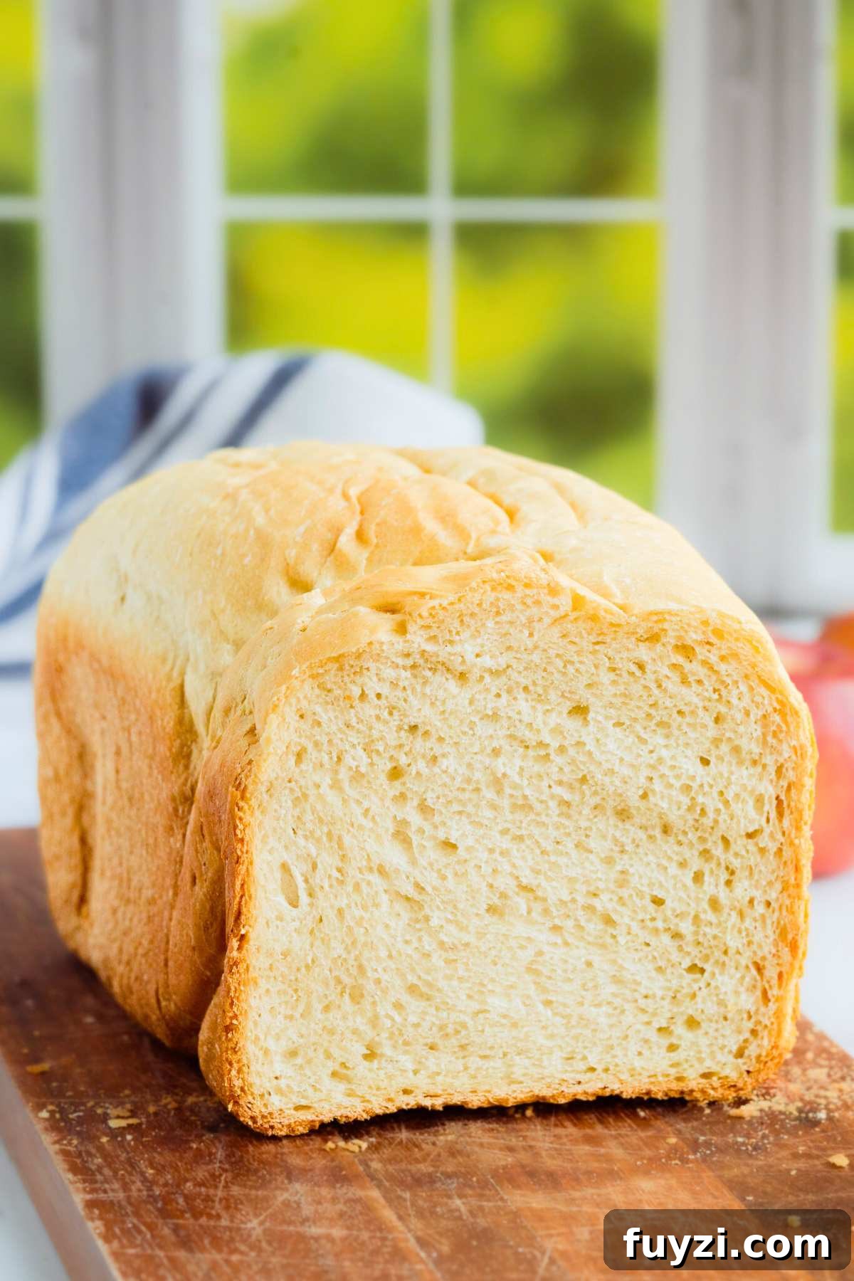 front shot of loaf with end cut off to reveal inside of bread.