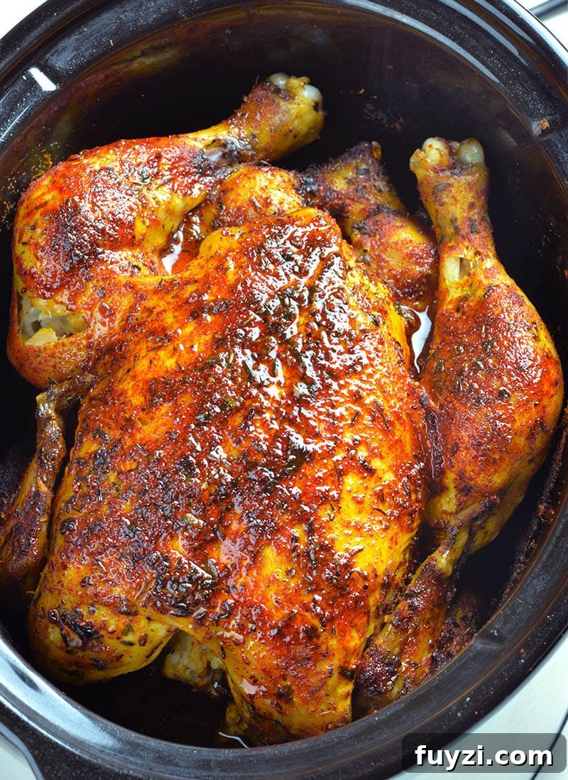 Whole chicken cooked in a slow cooker.