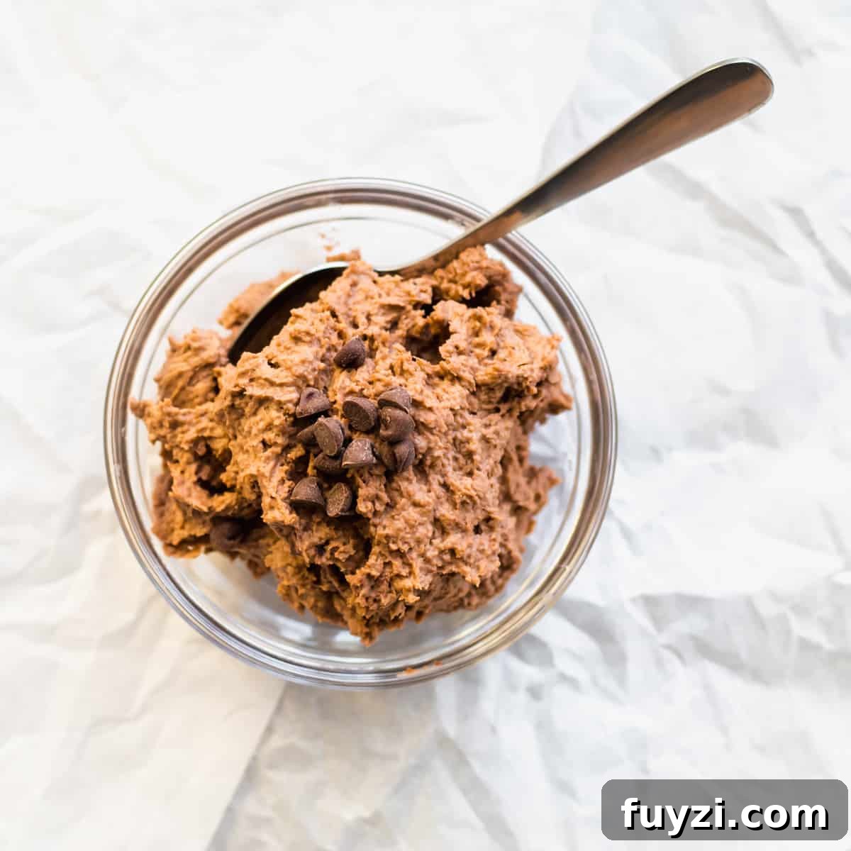chocolate mousse in a mason jar with a spoon.