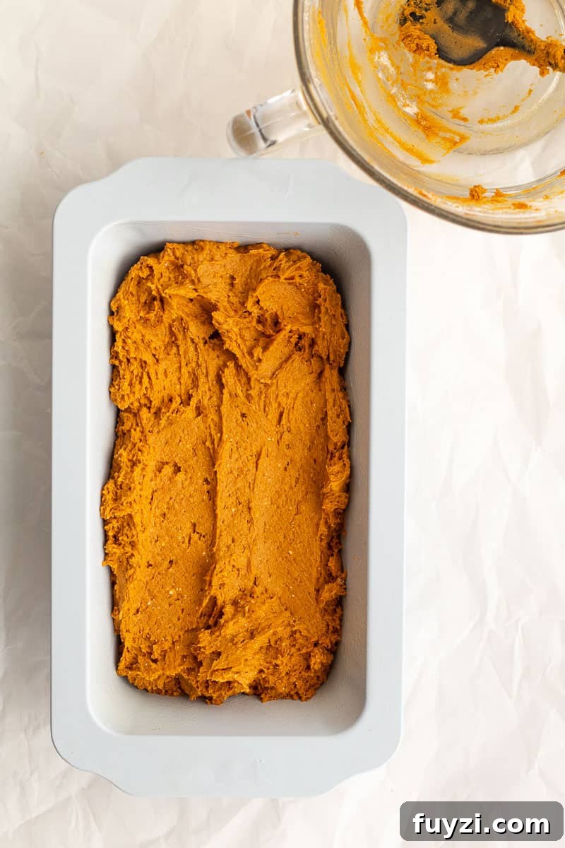 pumpkin batter in a loaf pan